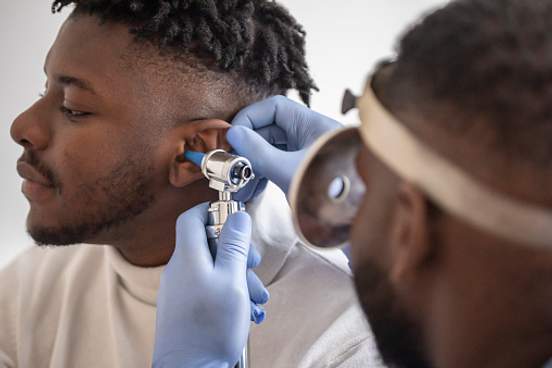 doctor examining ear
