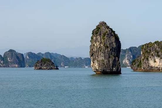 freestanding rock island in bay