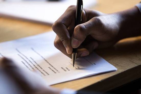 hand-signing-paper