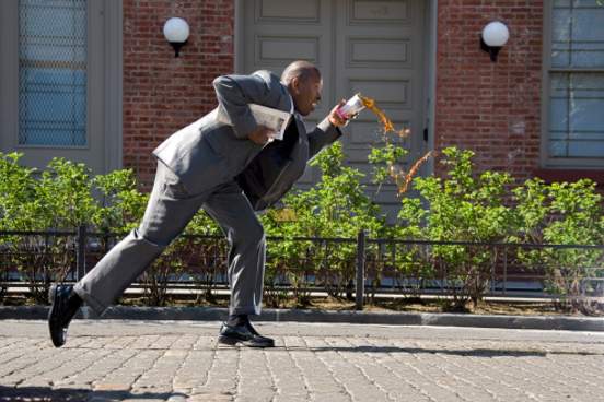 man dropping drink