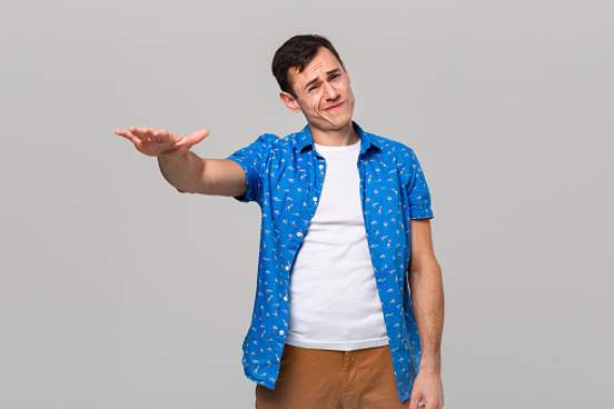 man making so-so gesture