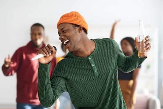 man singing karaoke