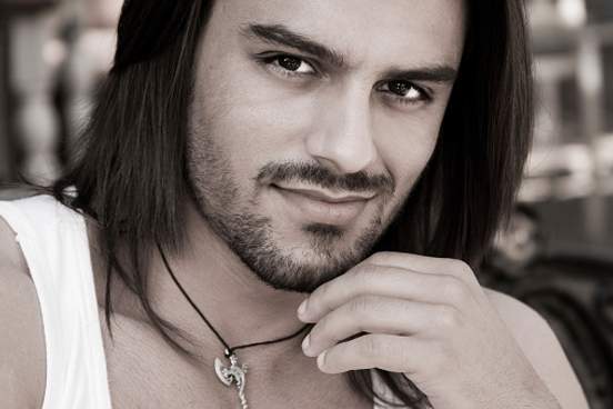 man with roguish smile