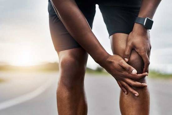man-holding-knee