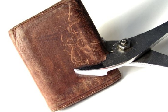 pliers gripping wallet photo