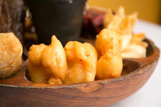 pupu platter served in a wooden bowl