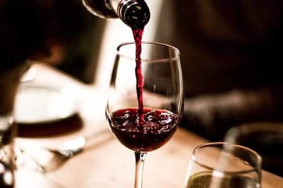 red wine being poured into glass