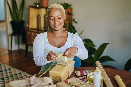 smiling woman wrapping presents