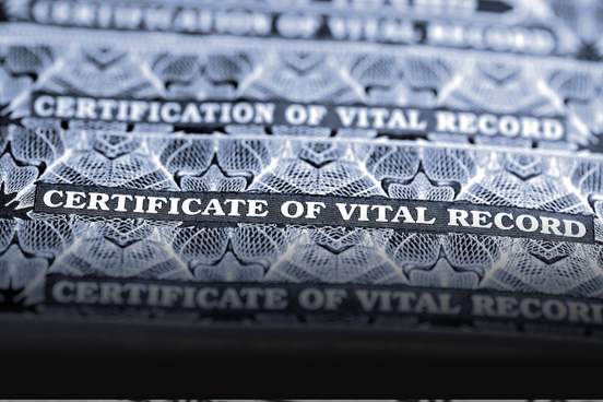 stack of official documents certificate of vital records