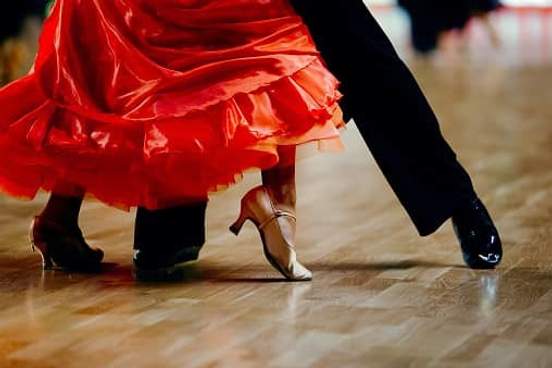 the feet of two tango dancers