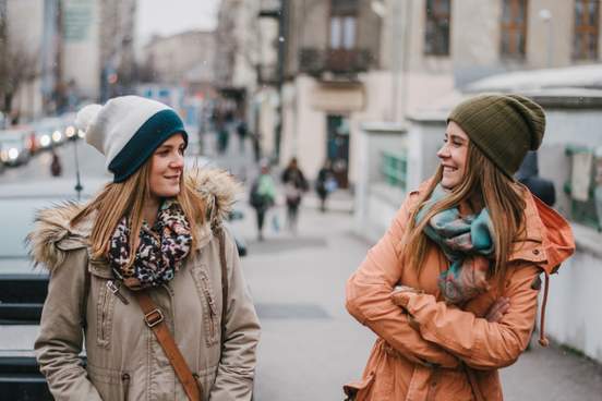 two women who look alike meet each other on the street