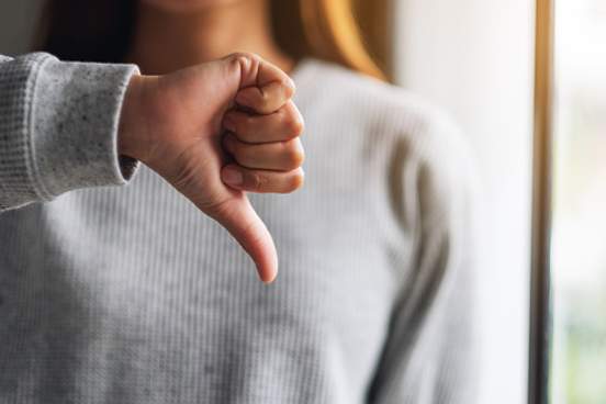 woman giving thumbs down