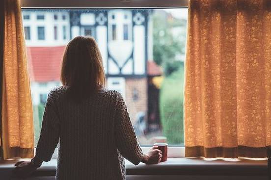 woman-looking-out-window