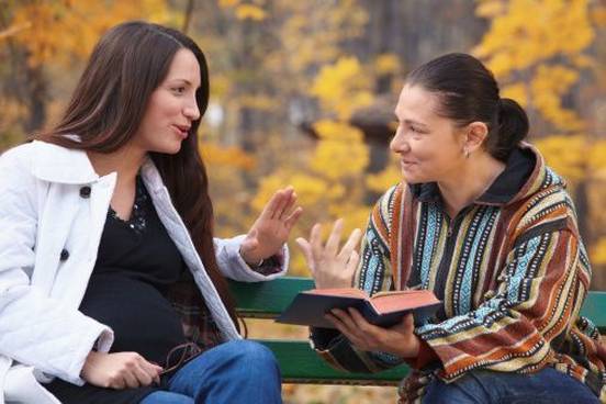 women-discussing-book