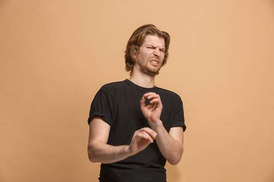 young man looking disgusted