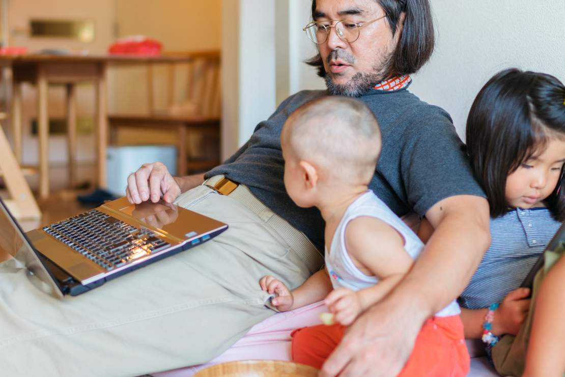 father-working-from-home-with-kids