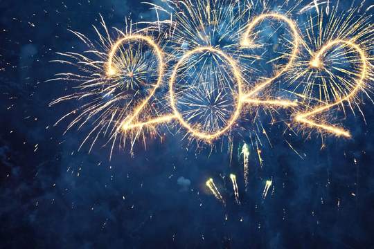 fireworks in a dark sky spell out 2022