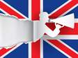 silhouette of a man with a megaphone against a british flag