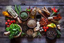a table filled with colorful herbs and spices
