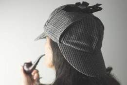 back-of-woman-head-deerstalker-pipe