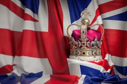 royal golden crown with jewels on british flag 