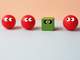 image of a green cube out of place in a lineup of red spheres 