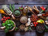 a table filled with colorful herbs and spices